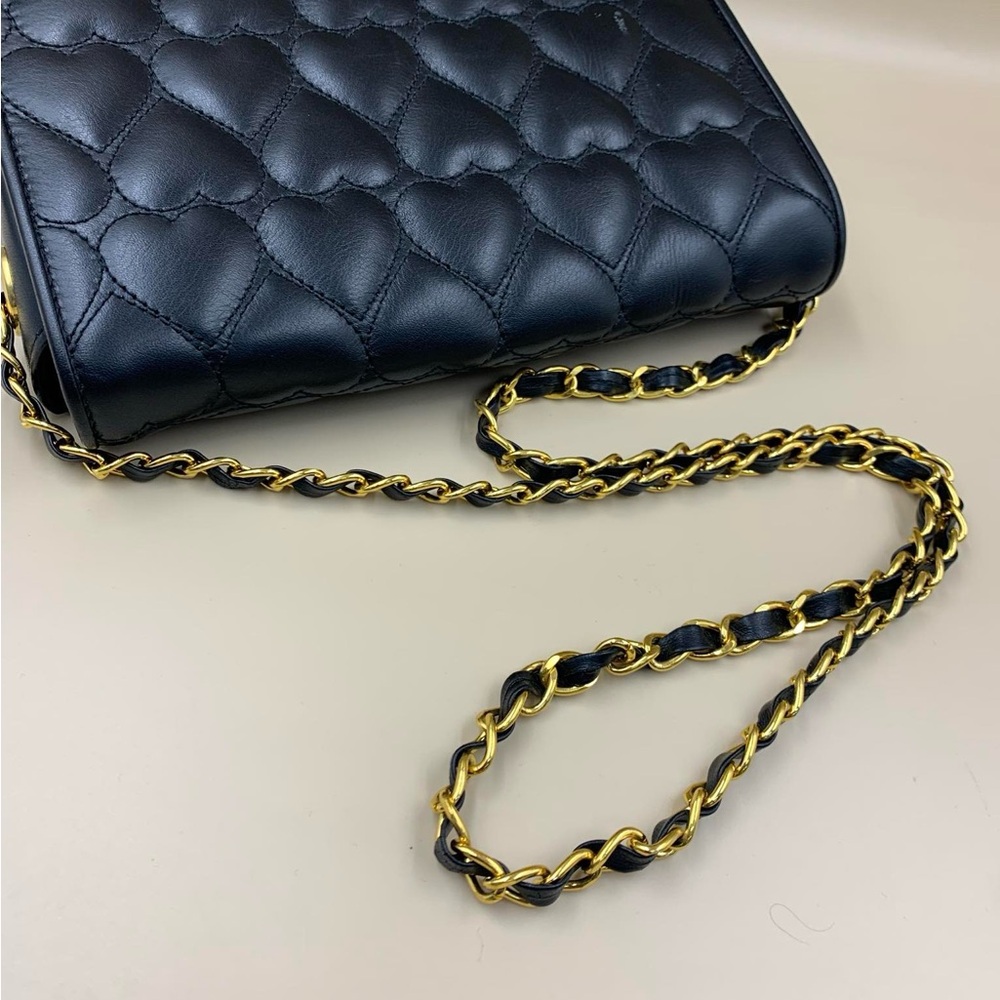 Moschino Elegant Black Crossbody Bag with Quilted Texture and Gold Hardware